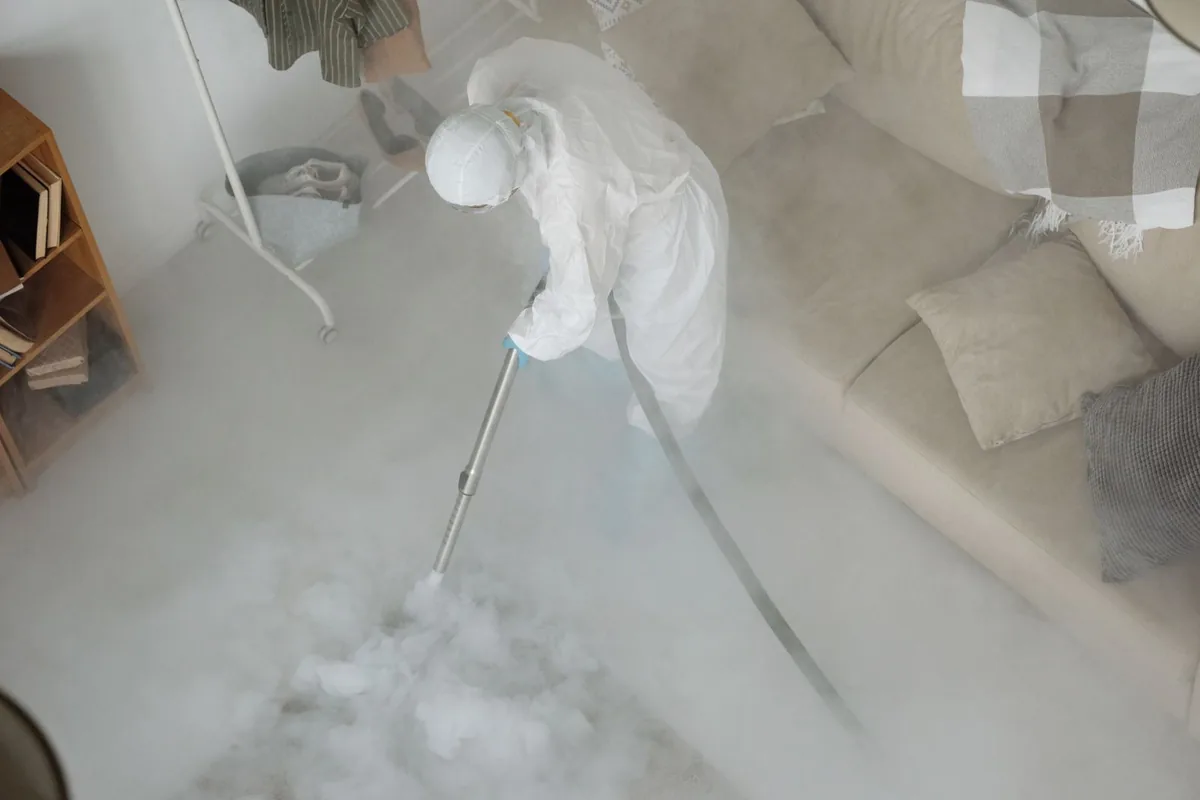 Biohazard cleanup technician in protective equipment, River Park, Sacramento, CA